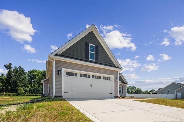 view of property exterior featuring a yard and a garage