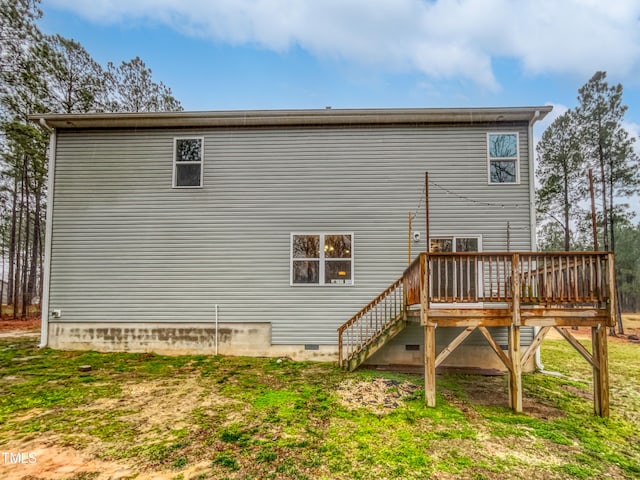 rear view of property with a wooden deck