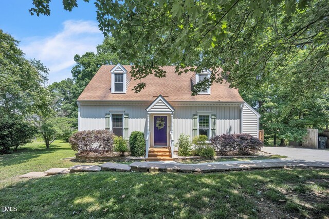 6328 Jones Farm Rd, Wake Forest, NC 27587 - cape cod-style house with a front lawn and roof with shingles