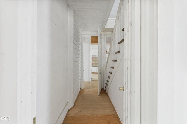 hallway with light wood-type flooring