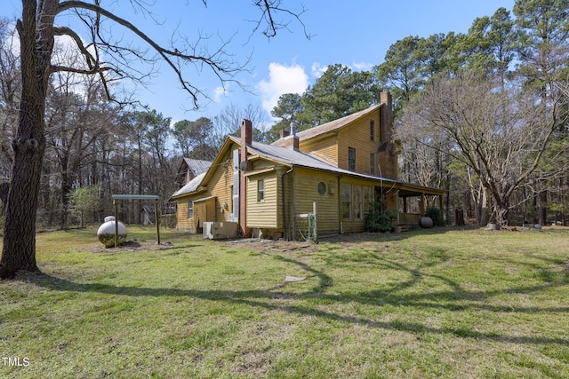 view of home's exterior with a lawn