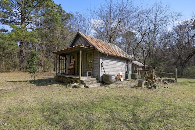 view of side of home featuring a lawn