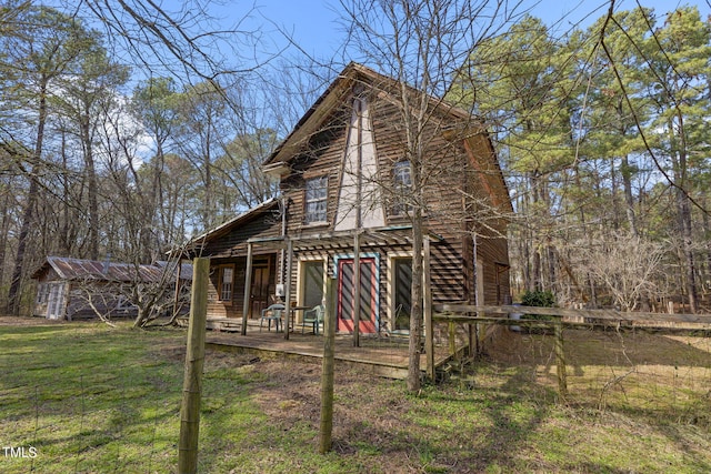 rear view of house with a lawn