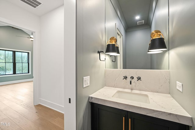 bathroom with vanity and hardwood / wood-style floors