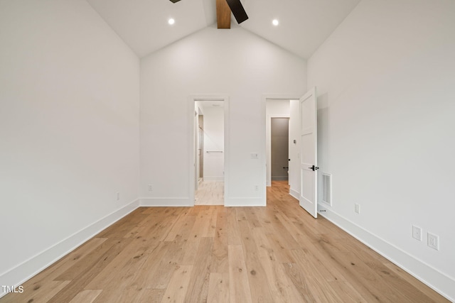 unfurnished bedroom with light hardwood / wood-style flooring, beam ceiling, ceiling fan, and high vaulted ceiling