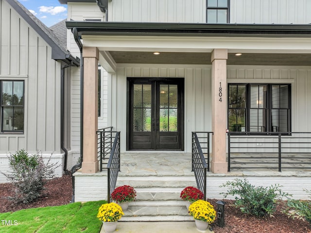 view of exterior entry with a porch