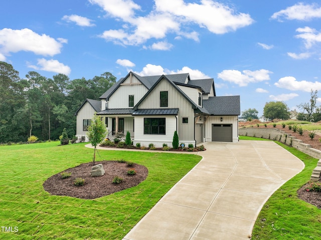 modern farmhouse style home with a front lawn and a garage