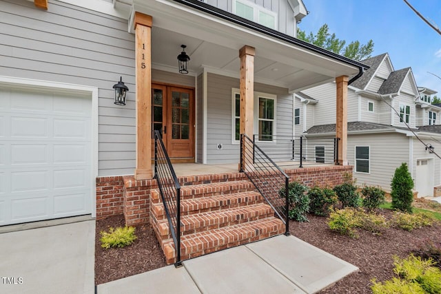 entrance to property with board and batten siding, covered porch, and brick siding