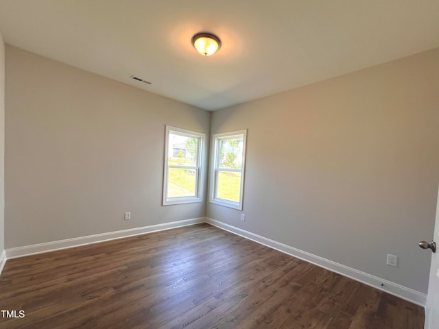 empty room featuring dark hardwood / wood-style floors