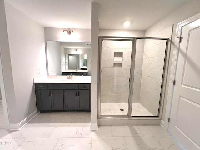 bathroom featuring vanity and a shower with shower door