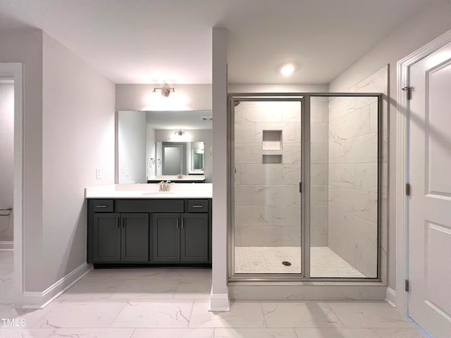 bathroom featuring vanity and an enclosed shower