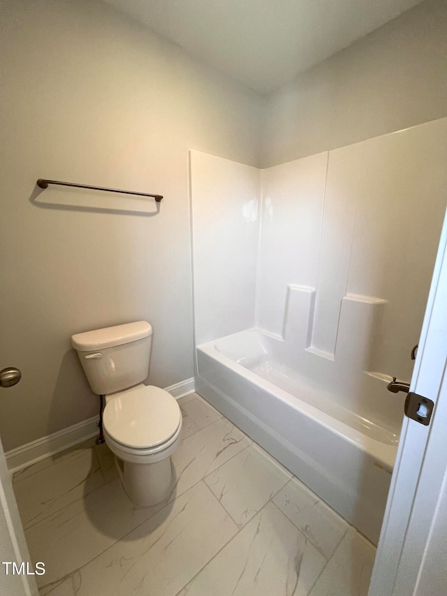 bathroom featuring toilet and shower / tub combination