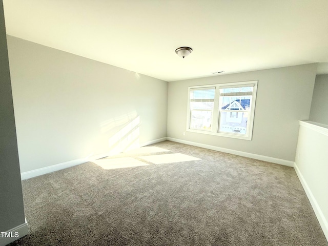 unfurnished room with carpet floors