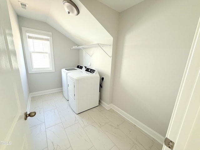 laundry area featuring washing machine and clothes dryer