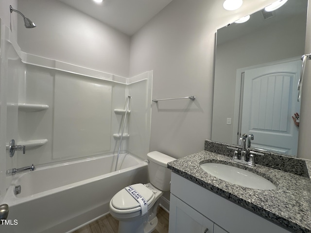 full bathroom with toilet, vanity, shower / washtub combination, and hardwood / wood-style floors