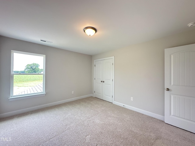 view of carpeted spare room