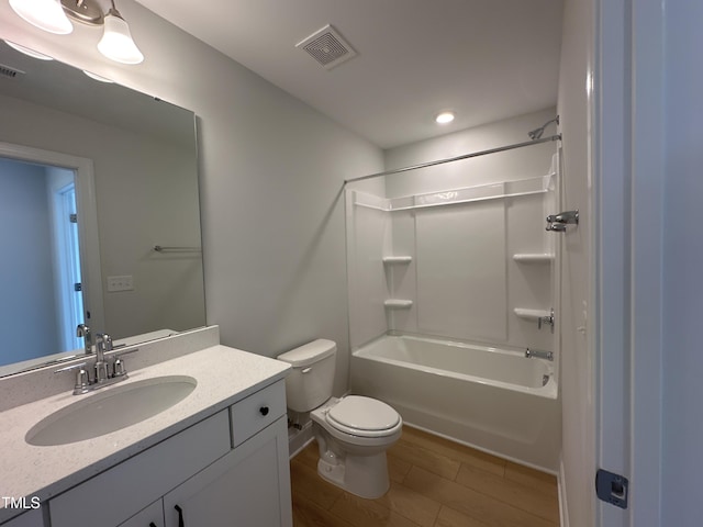 full bathroom featuring shower / bath combination, toilet, vanity, and hardwood / wood-style floors