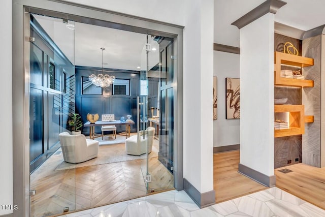 1312 Hunting Ridge Rd, Raleigh, NC 27615 - corridor with baseboards, a desk, a chandelier, parquet flooring, and healthy amount of natural light