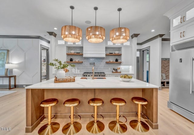 1312 Hunting Ridge Rd, Raleigh, NC 27615 - kitchen featuring stainless steel built in refrigerator, open shelves, light wood-type flooring, decorative backsplash, and white cabinetry