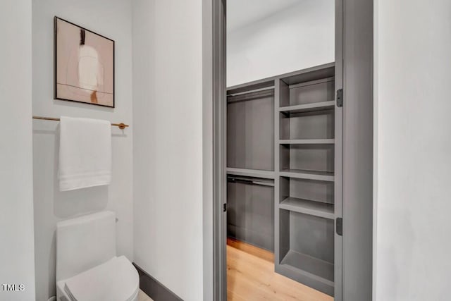 1312 Hunting Ridge Rd, Raleigh, NC 27615 - bathroom with toilet and wood finished floors