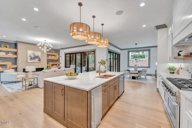 1312 Hunting Ridge Rd, Raleigh, NC 27615 - kitchen with a sink, appliances with stainless steel finishes, ornamental molding, recessed lighting, and light wood finished floors