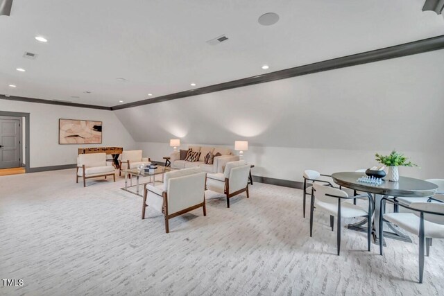 1312 Hunting Ridge Rd, Raleigh, NC 27615 - living room with baseboards, recessed lighting, vaulted ceiling, ornamental molding, and light colored carpet
