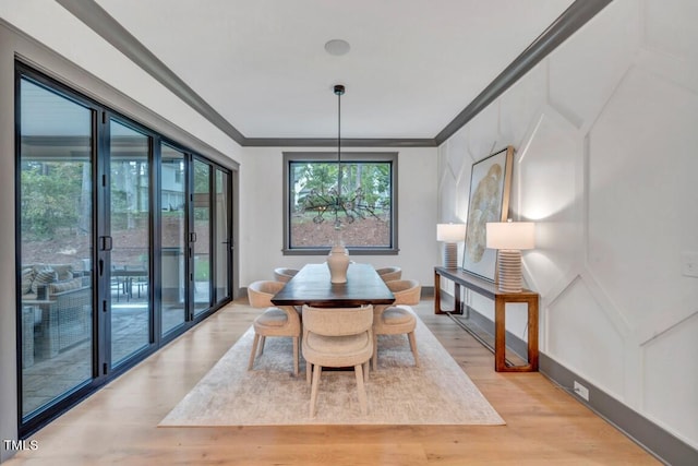1312 Hunting Ridge Rd, Raleigh, NC 27615 - dining area featuring light wood-type flooring and ornamental molding
