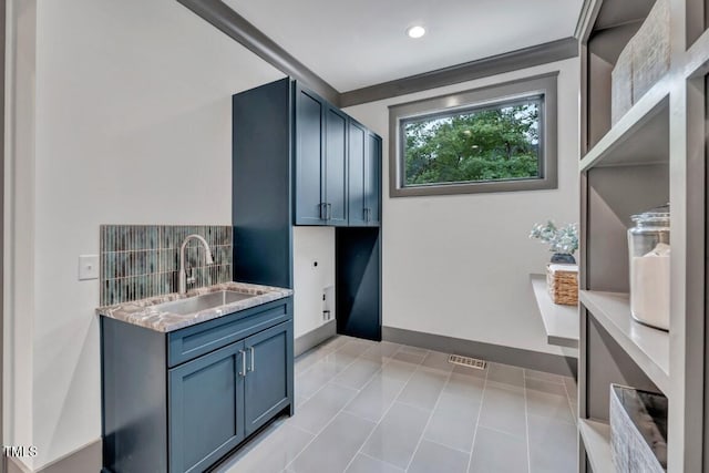 1312 Hunting Ridge Rd, Raleigh, NC 27615 - washroom with a sink, recessed lighting, and baseboards