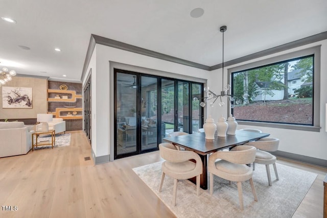 1312 Hunting Ridge Rd, Raleigh, NC 27615 - dining room with crown molding, wood finished floors, baseboards, recessed lighting, and french doors