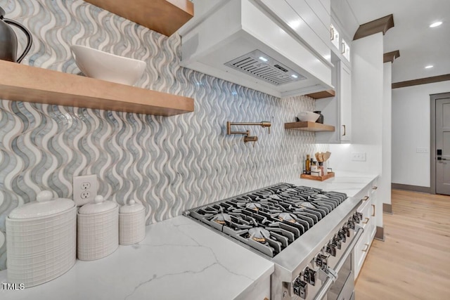 1312 Hunting Ridge Rd, Raleigh, NC 27615 - kitchen featuring open shelves, premium range hood, light stone counters, white cabinetry, and recessed lighting