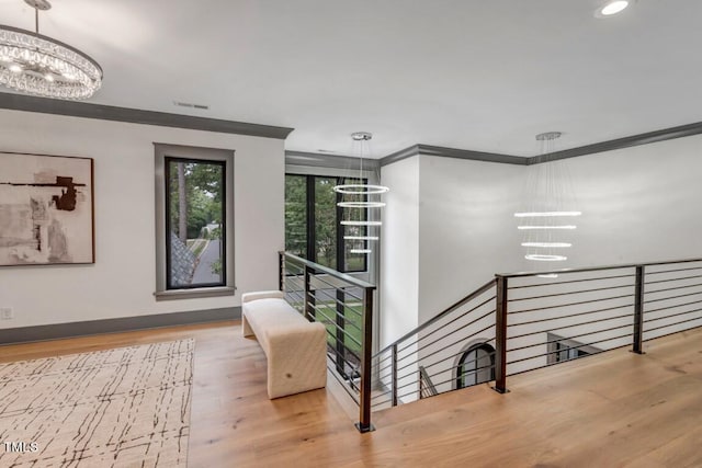 1312 Hunting Ridge Rd, Raleigh, NC 27615 - staircase featuring a chandelier, wood finished floors, recessed lighting, ornamental molding, and baseboards