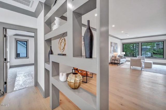 1312 Hunting Ridge Rd, Raleigh, NC 27615 - hallway with wood finished floors, built in shelves, and baseboards