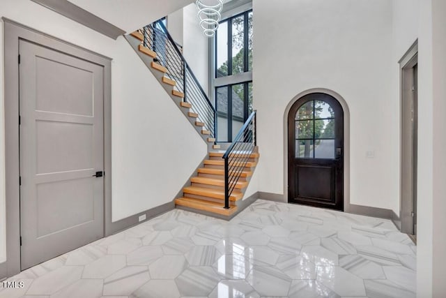 1312 Hunting Ridge Rd, Raleigh, NC 27615 - foyer entrance featuring arched walkways and stairway