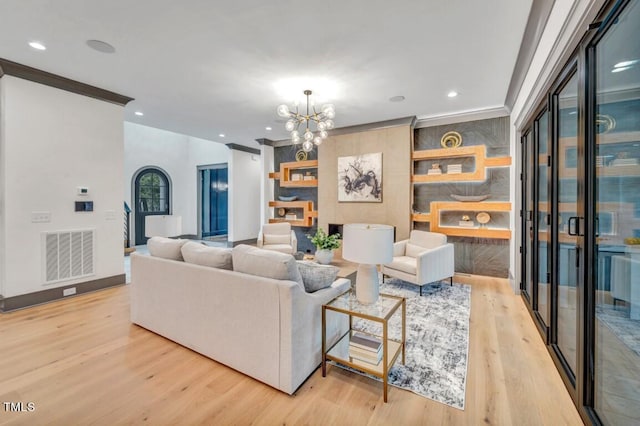 1312 Hunting Ridge Rd, Raleigh, NC 27615 - living area featuring a chandelier, wood finished floors, baseboards, and recessed lighting