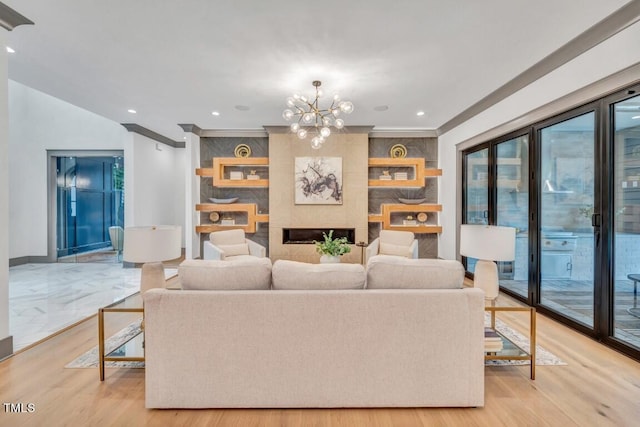 1312 Hunting Ridge Rd, Raleigh, NC 27615 - living area with a chandelier, light wood-type flooring, crown molding, baseboards, and recessed lighting