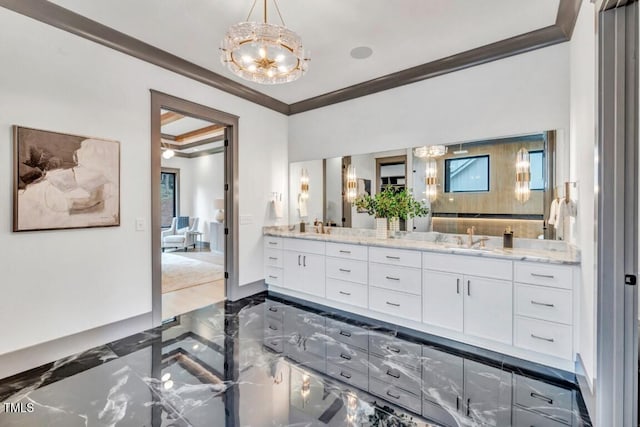 1312 Hunting Ridge Rd, Raleigh, NC 27615 - bathroom featuring crown molding, a chandelier, double vanity, and marble tiled floors