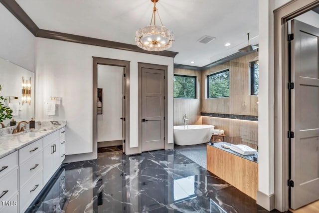 1312 Hunting Ridge Rd, Raleigh, NC 27615 - full bathroom featuring marble tiled floors, a freestanding bath, vanity, a chandelier, and recessed lighting