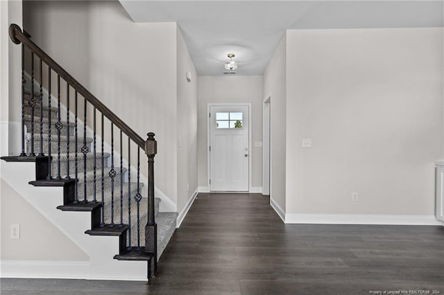 entryway with dark wood-type flooring