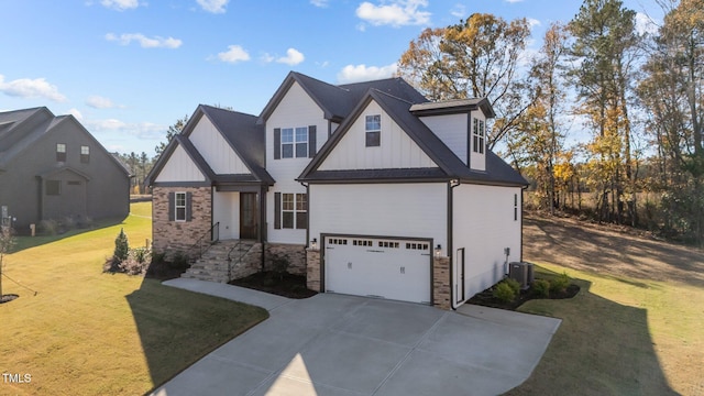 view of front of home with a garage and a front yard
