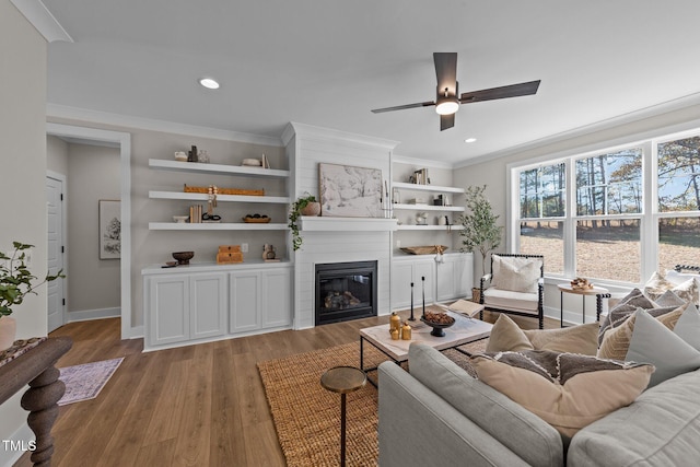 148 Hook Dr Lot 7, Fuquay Varina, NC 27526 - living room with a ceiling fan, a glass covered fireplace, light wood-type flooring, baseboards, and recessed lighting