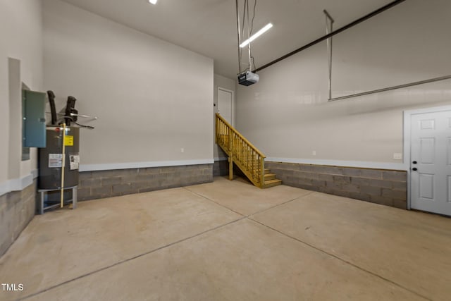 148 Hook Dr Lot 7, Fuquay Varina, NC 27526 - garage featuring electric water heater, a garage door opener, electric panel, and ceiling fan