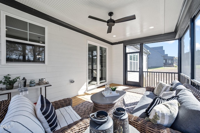 sunroom / solarium with ceiling fan