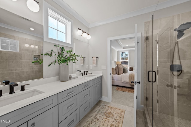bathroom with vanity, tile patterned flooring, a shower with shower door, and ornamental molding