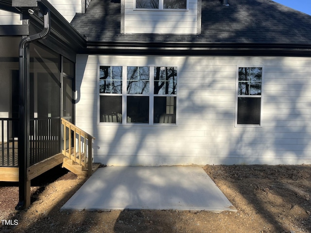 view of side of property with a patio