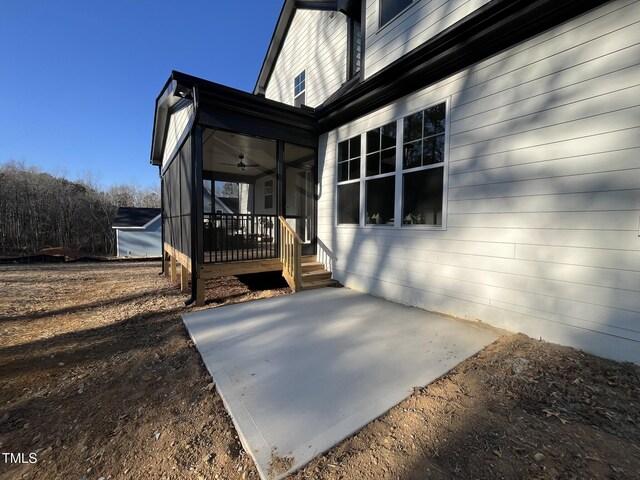 exterior space with ceiling fan