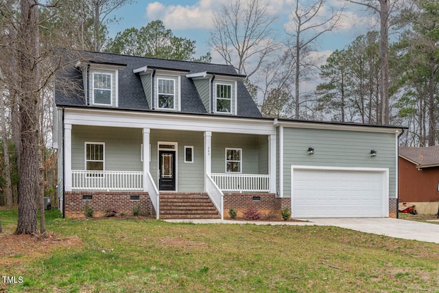 new england style home with covered porch, a front yard, and a garage