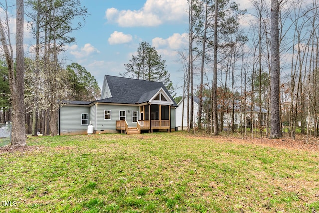 exterior space with a deck and a lawn