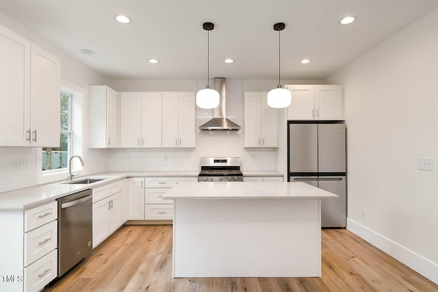 kitchen with light hardwood / wood-style floors, stainless steel appliances, and white cabinetry