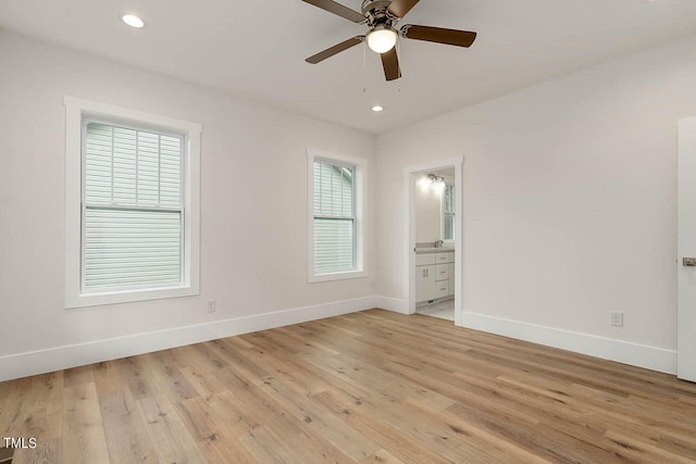 empty room with light hardwood / wood-style floors and ceiling fan