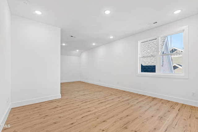 spare room featuring light hardwood / wood-style flooring